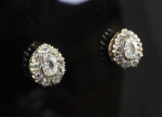 A pair of unmarked gold and old cut diamond cluster earrings,